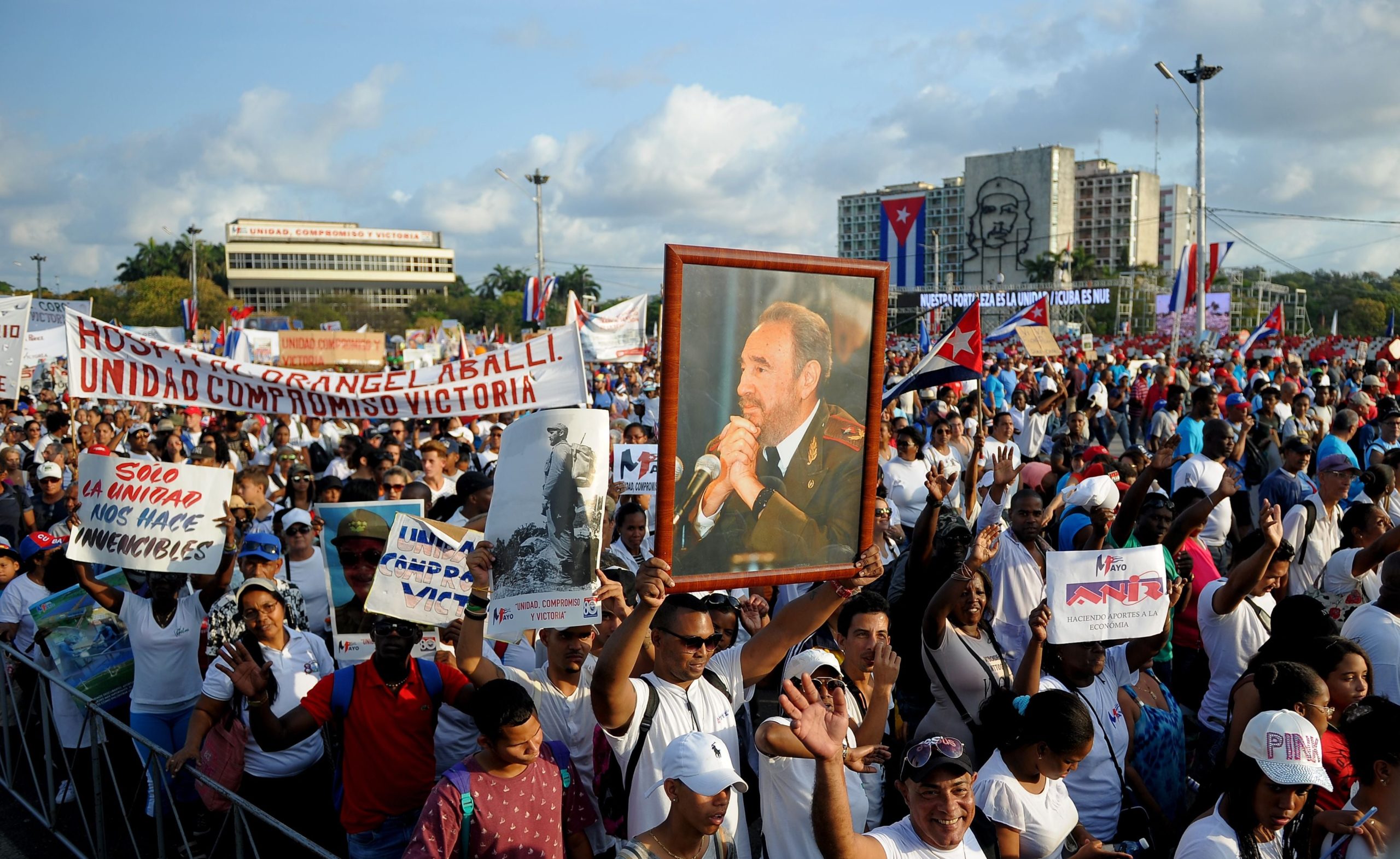 A poster with an image of late Cuban leader Fidel Castro is seen amid the crowd during the May Day rally at Revolution Square in Havana on May 1, 2018.  (Photo: Yamil Lage, Getty Images)