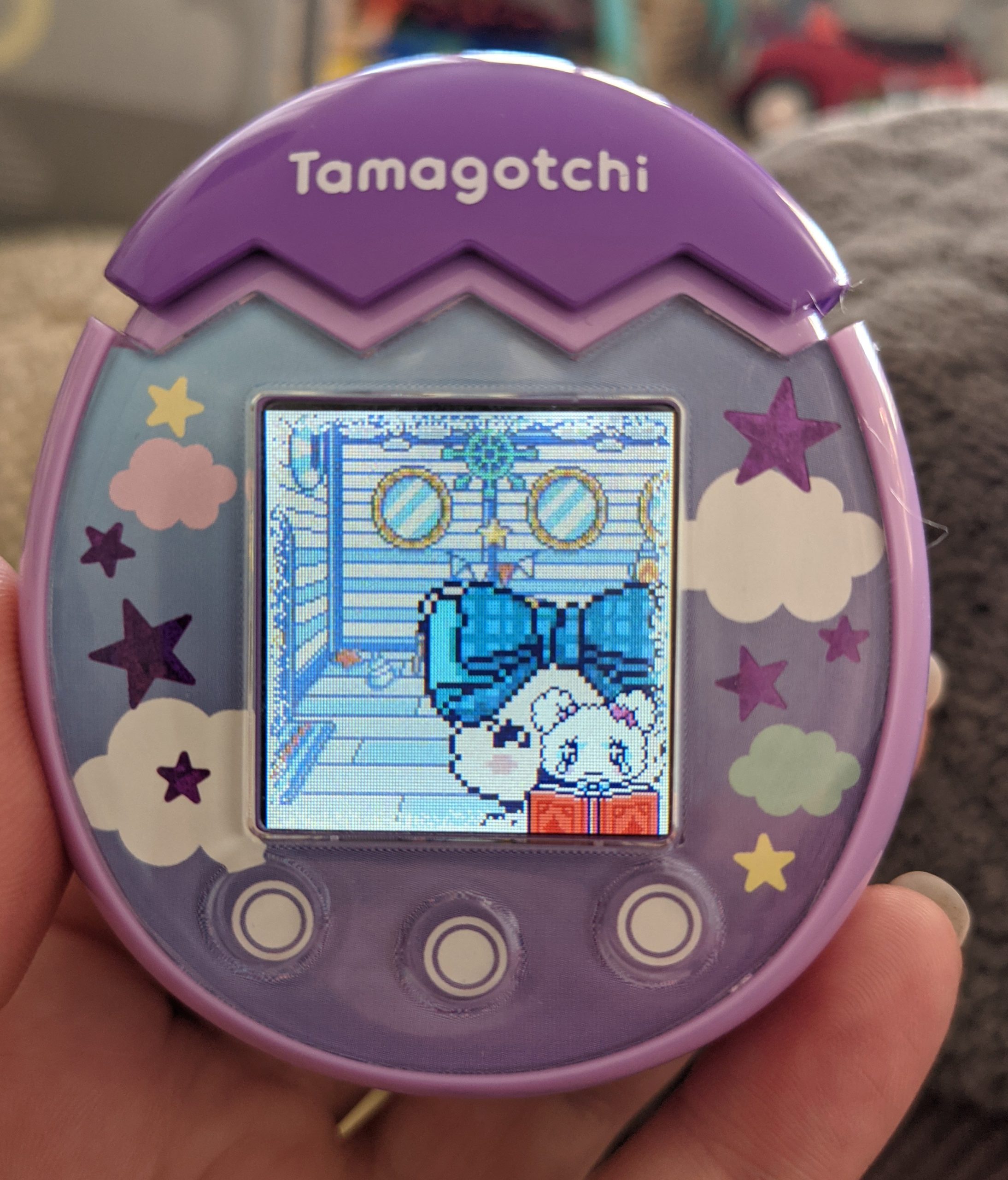 When your Tamagotchi is ready to return to its home planet, it will ask you to start putting together a photo album and go through the precious memories.  (Photo: Florence Ion / Gizmodo)