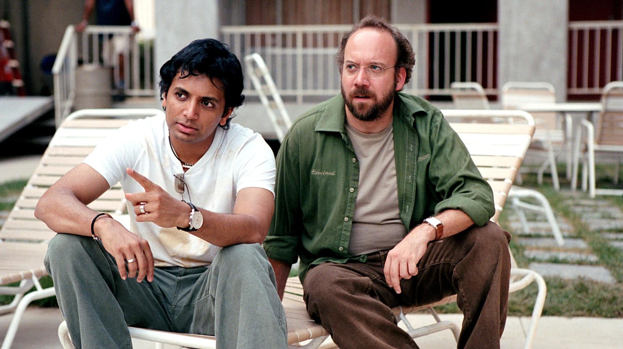 M. Night Shyamalan (left) played a character of grave importance in his own movie. (Photo: Warner Bros.)