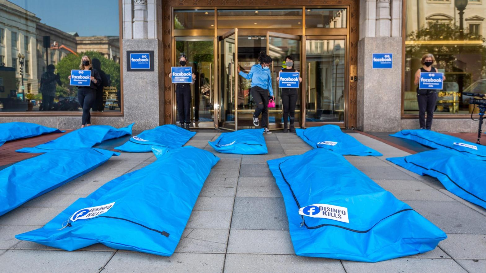 Photo: At Washington, DC Facebook headquarters, activists (the Real Facebook Oversight Board) lay body bags and call for Facebook to stop disinformation that leads to Covid deaths  on Wednesday, July. 28, 2021 in Washington. (Eric Kayne/AP Images for All the Citizens Ltd.), AP
