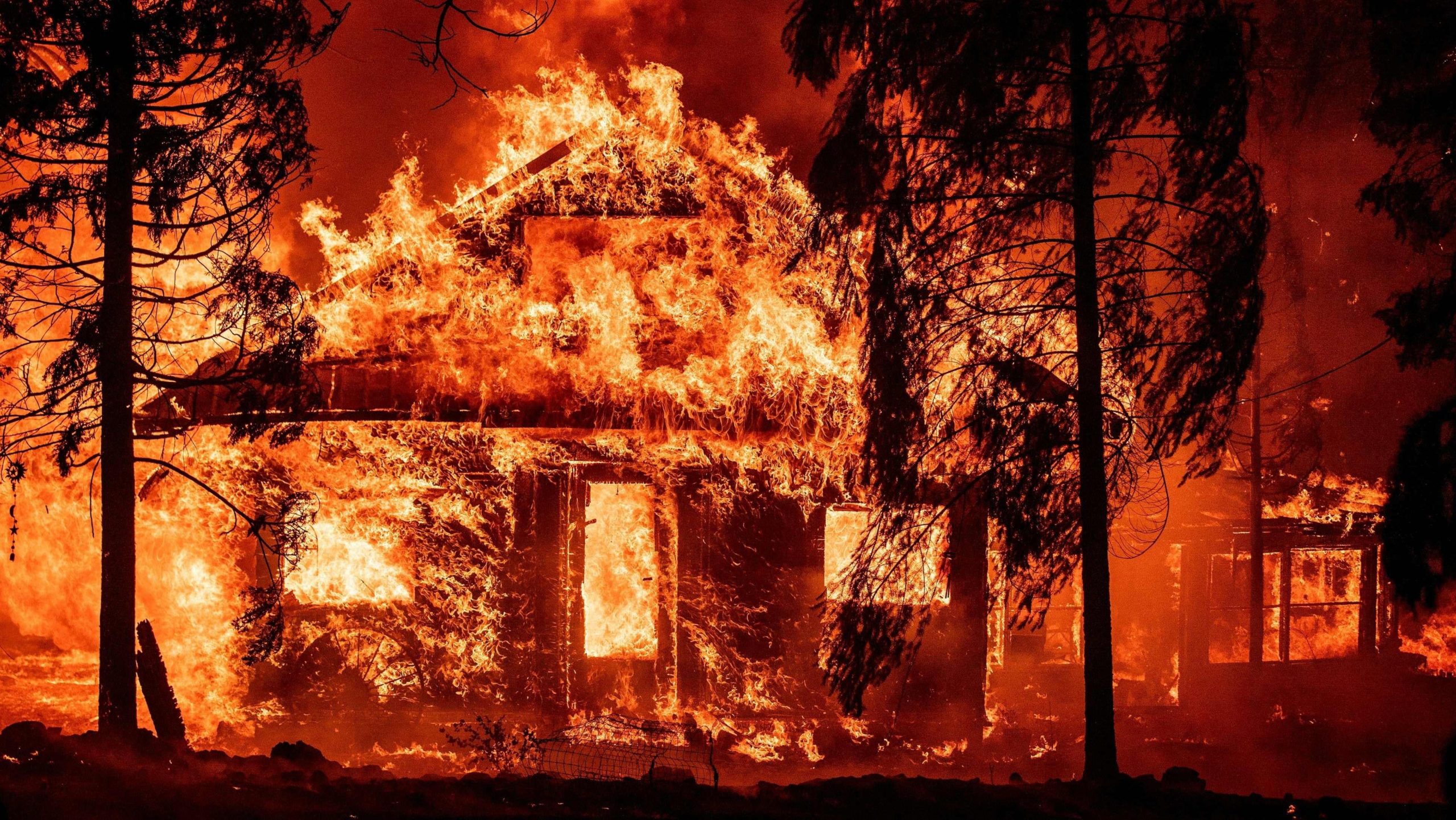 A home burning in Indian Falls, an area hit by the Dixie Fire. (Photo: Josh Edelson/AFP, Getty Images)