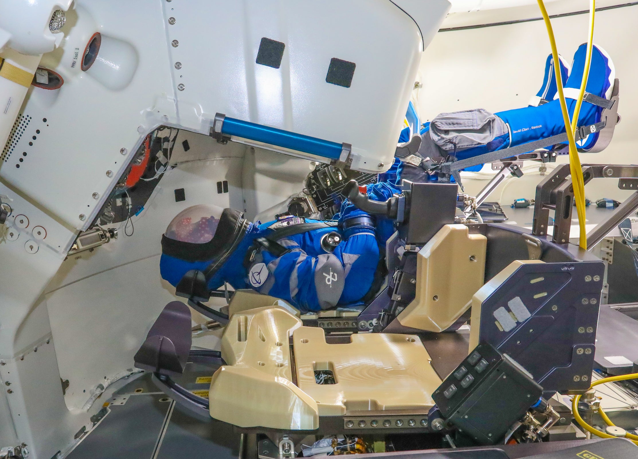 Rosie the Rocketeer, a anthropometric test device, strapped to the commander's seat inside the CST-100 Starliner spacecraft.  (Image: Boeing)