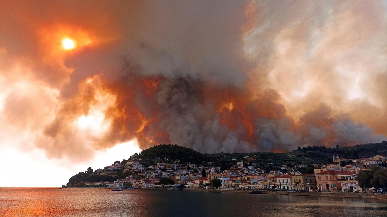 Flames burn on the mountain near Limni village on the island of Evia, about 160 kilometers (161 km) north of Athens, Greece, Tuesday, Aug. 3, 2021. (Photo: Michael Pappas, AP)