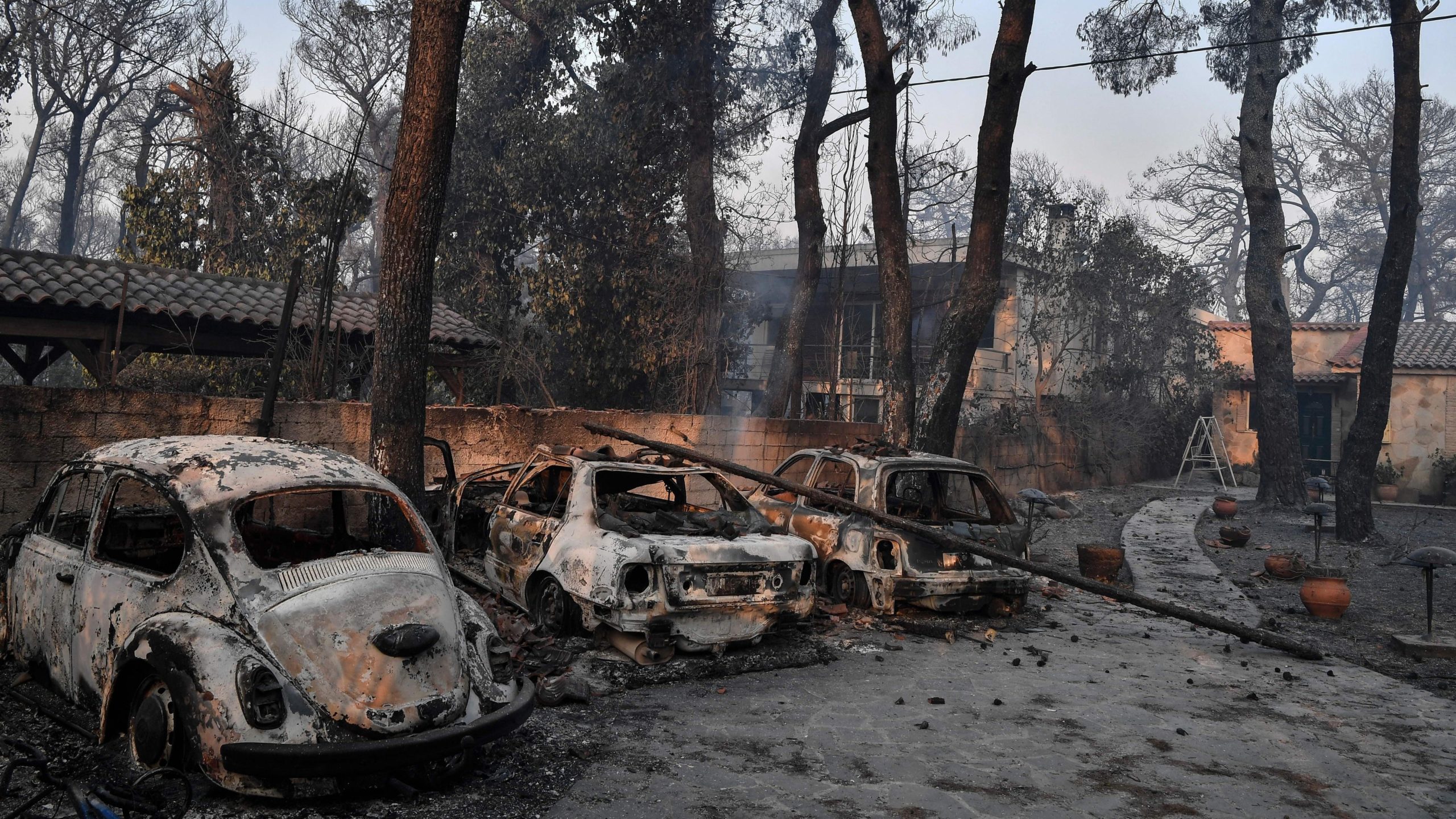 Burned cars in Varybombi. (Photo: Louise Gouliamaki/AFP, Getty Images)