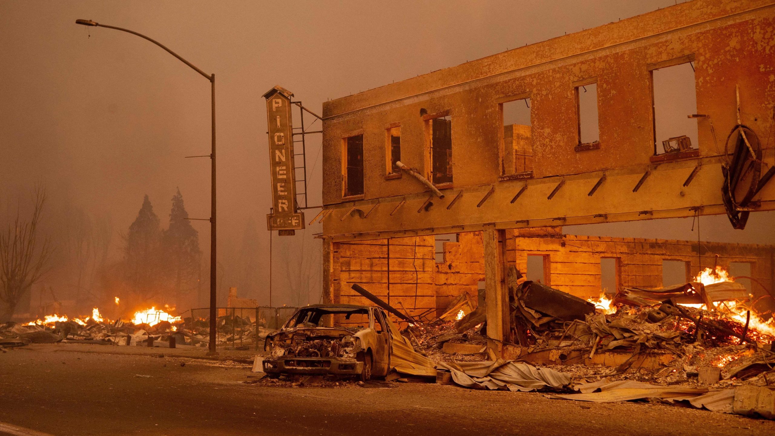 Businesses burn as the Dixie Fire tears through downtown Greenville, California. (Photo: Josh Edelson/AFP, Getty Images)