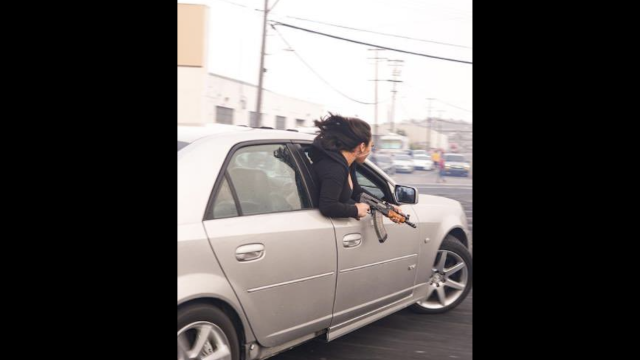 Woman Photographed Leaning Out Of A Cadillac Brandishing An AK-47, Car Impounded