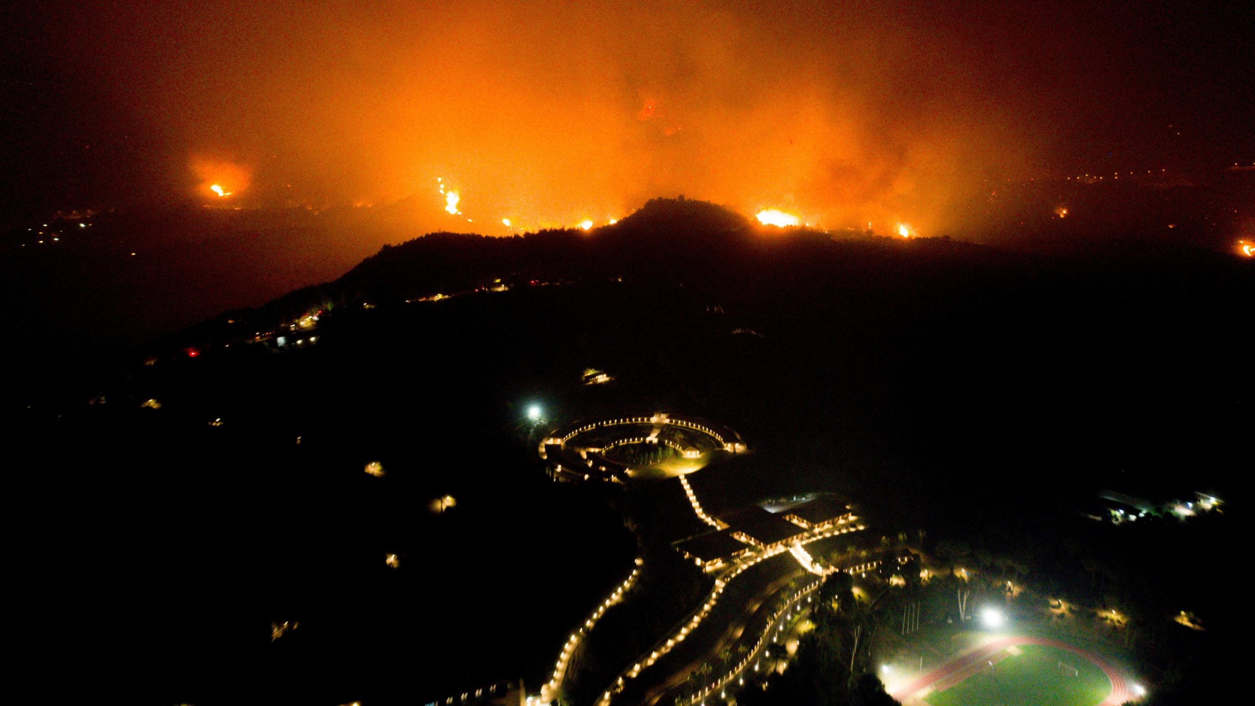 A wildfire approaches the Olympic Academy in western Greece on August 4, 2021. (Photo: Eurokinissi/AFP, Getty Images)