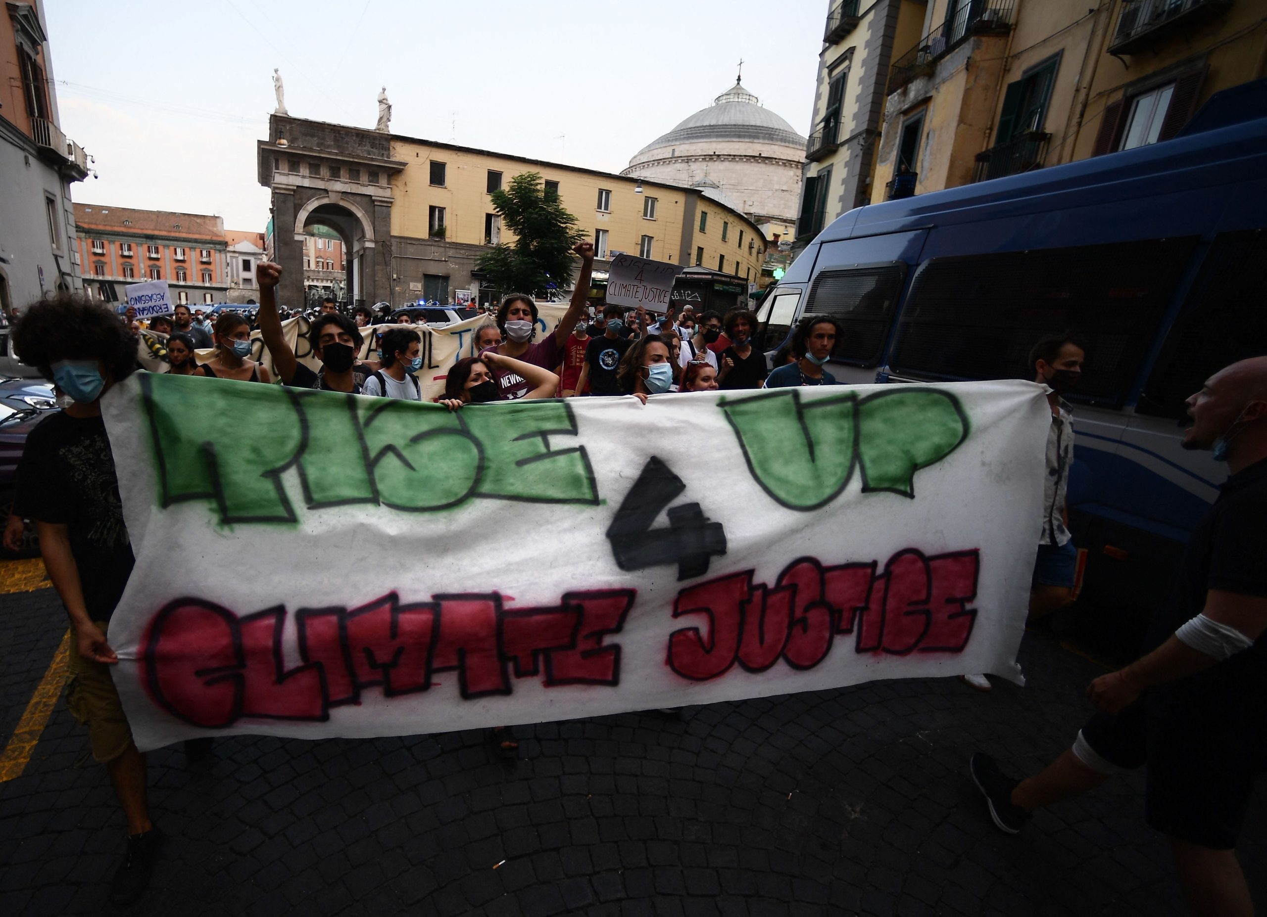 Protesters hold a banner in Naples on July 21, 2021, during a rally against the climate and energy G20 summit starting on July 22, 2021. (Photo: Filippo Monteforte, Getty Images)