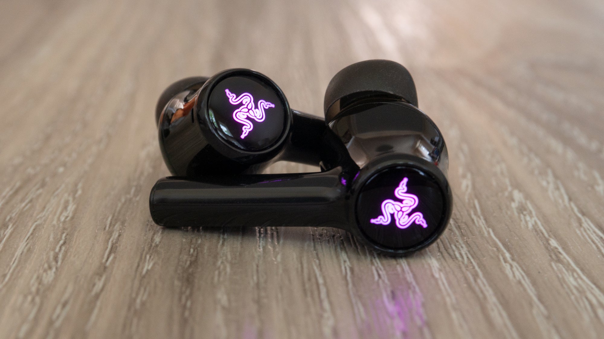 Don't expect other wireless earbud makers to copy the colour-changing LED feature Razer has included. (Photo: Andrew Liszewski - Gizmodo)
