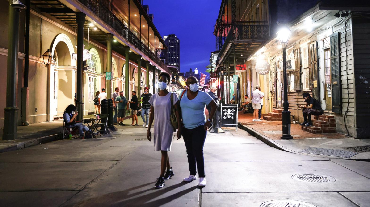 People wearing face masks walk on Bourbon Street in the French Quarter on August 12, 2021 in New Orleans, Louisiana.  (Photo: Mario Tama, Getty Images)