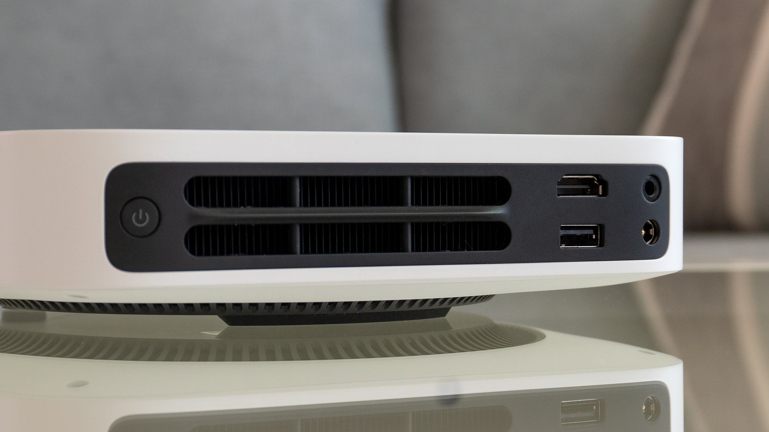 Connectivity is limited with the Elfin. On the back next to a cooling vent you'll only find a single HDMI port and a single USB port for playing media off an external drive, in addition to an audio connector and the power jack. (Photo: Andrew Liszewski - Gizmodo)