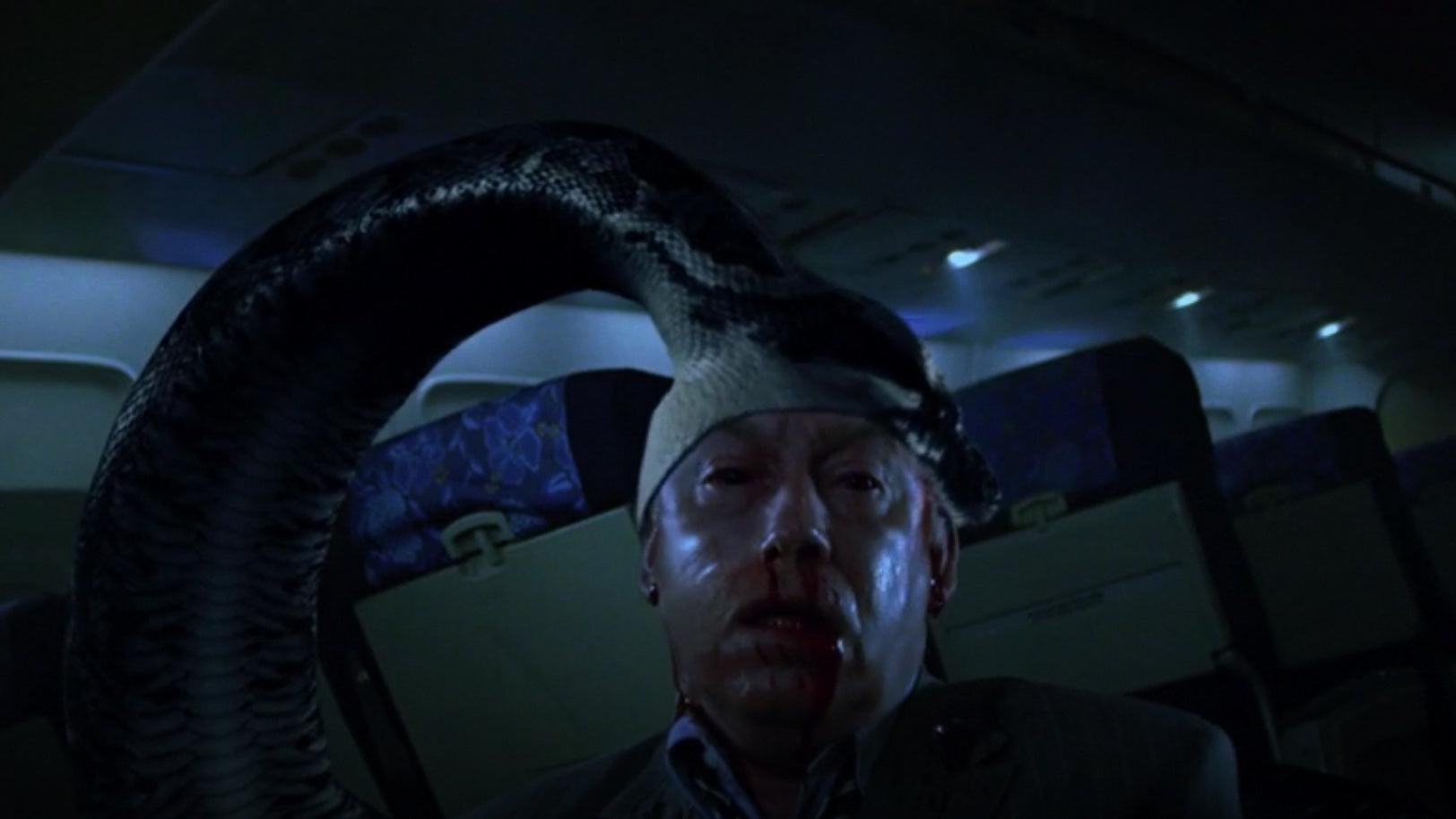 I had to screenshot this moment from the movie where a huge snake eats a man alive. (Screenshot: New Line Cinema)