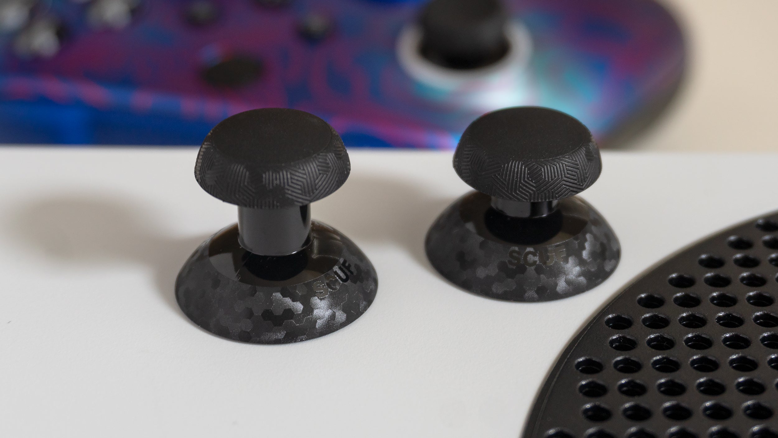 The Scuf Instinct and Instinct Pro come with alternate dome-topped joysticks, one short and one tall so you can test which one might work better for you. (Photo: Andrew Liszewski - Gizmodo)