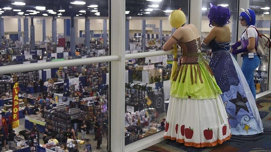 Fans dressed in costume look down on the Florida SuperCon convention floor on June 25, 2015, at the Miami Beach Convention Centre in Miami, Florida. Florida Supercon will run from 24-28 June and will feature Comic Book, Anime, Animation, Video Game, Fantasy, Sci-Fi and Pop Culture.  (Photo: RHONA WISE/AFP, Getty Images)