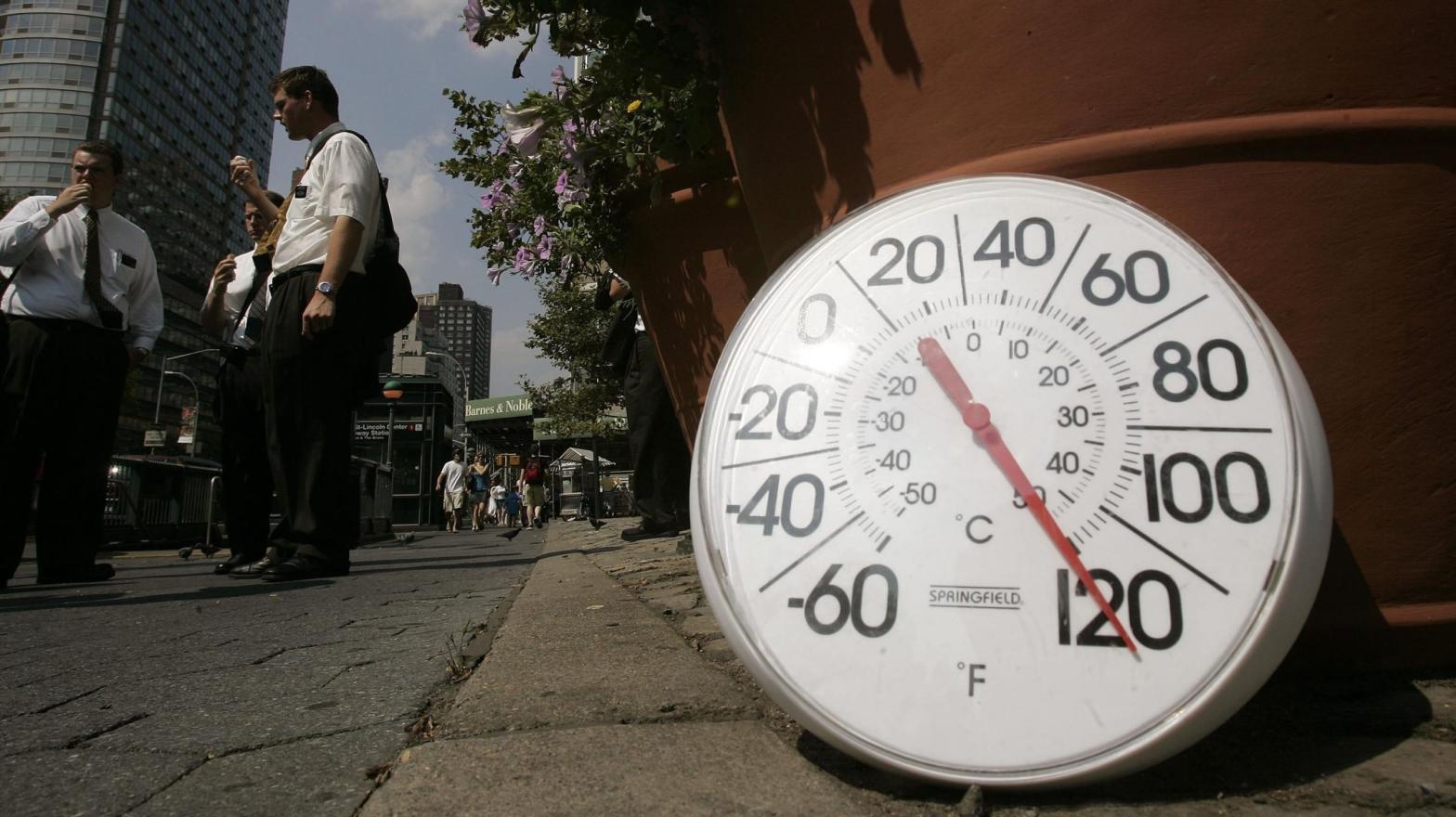 A thermometer in the sun on the footpath indicates a temperature of 120 degrees Fahrenheit as people eat ice cream on the Upper West Side August 2, 2006  (Photo: Chris Hondros, Getty Images)