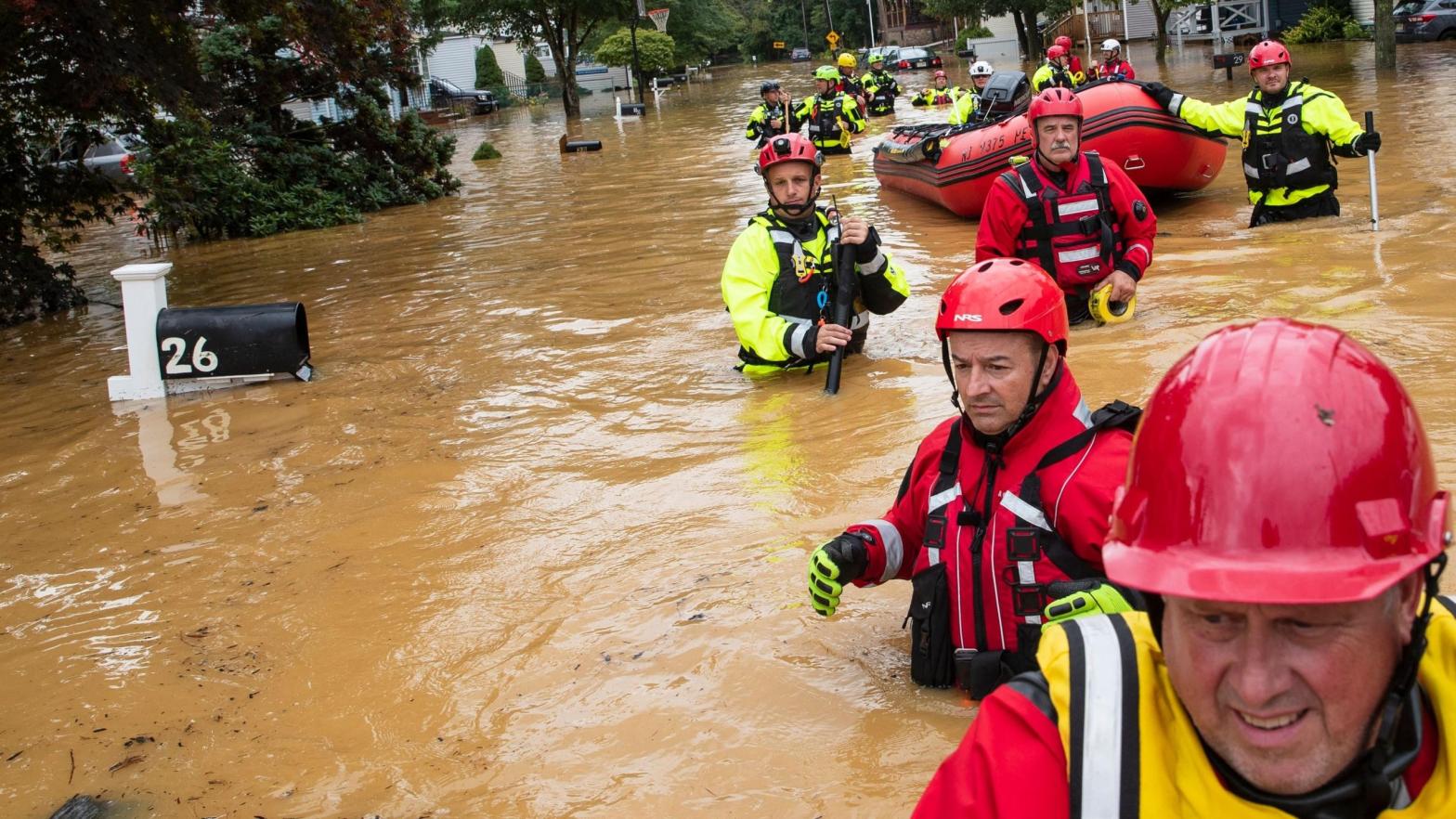 Members of the New Market Volunteer Fire Company perform a secondary search during an evacuation effort following a flash flood in Helmetta, New Jersey, on August 22, 2021, as a result of Tropical Storm Henri. (Photo: Tom Brenner, Getty Images)