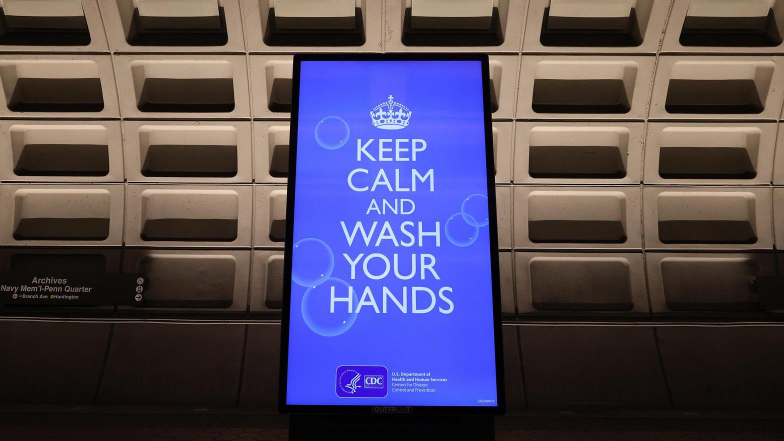 An electronic billboard flashes instructions on the train platform at the Archives station in Washington D.C. on March 25, 2020.  (Photo: Chip Somodevilla, Getty Images)
