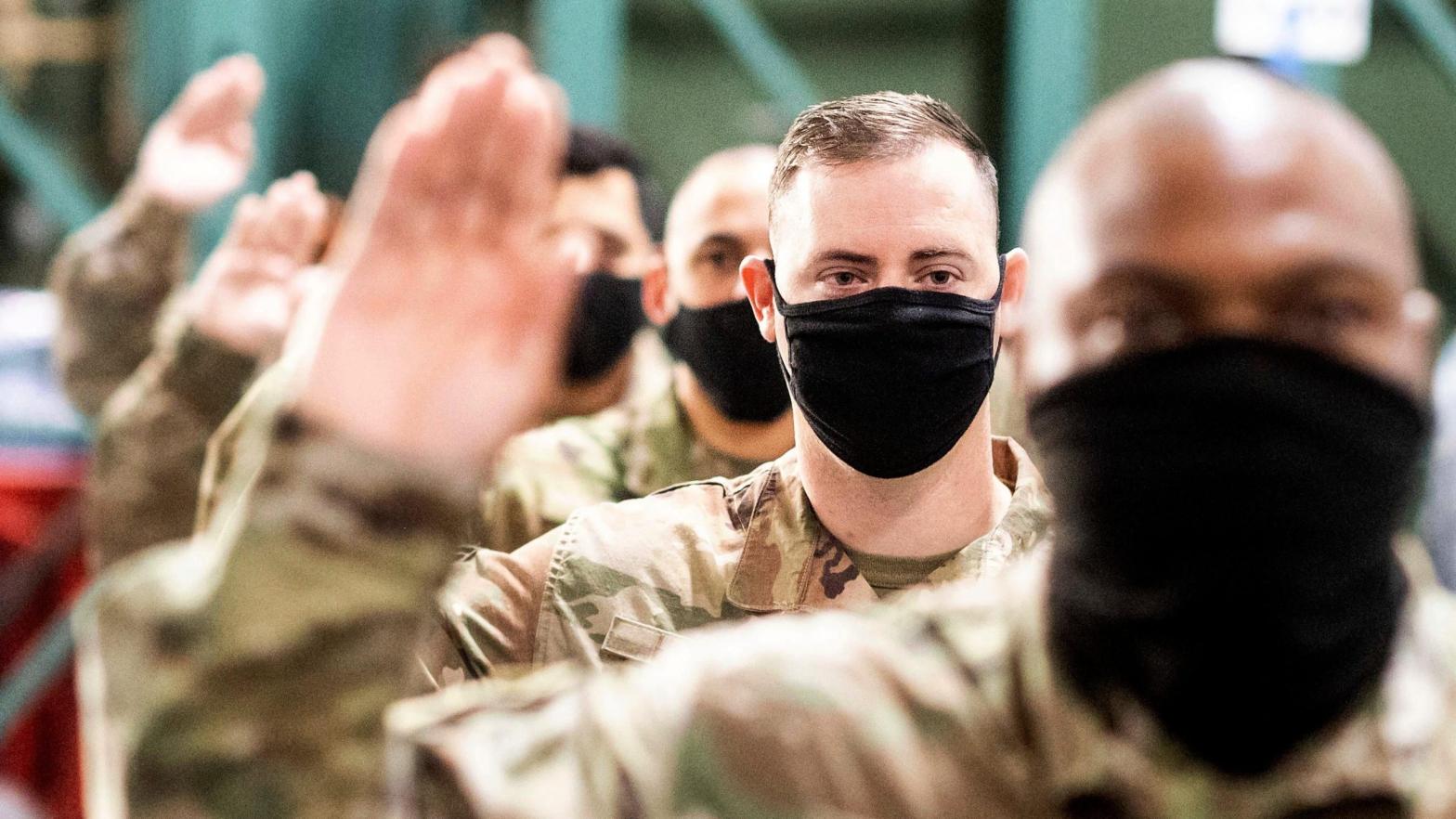 Air Force personnel reciting an oath to join the Space Force at Travis Air Force Base in California in February 2021. (Photo: Noah Berger, AP)