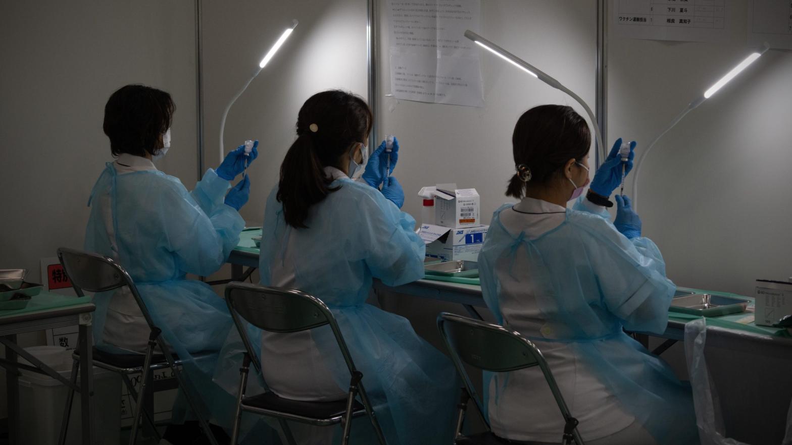 Medical staff prepare syringes of the Moderna vaccine at a vaccination centre on June 30, 2021 in Tokyo, Japan. (Photo: Carl Court, Getty Images)