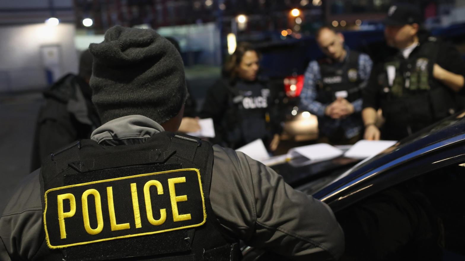 U.S. Immigration and Customs Enforcement (ICE) officers prepare for immigration raids in April 2018 in New York City. (Photo: John Moore, Getty Images)