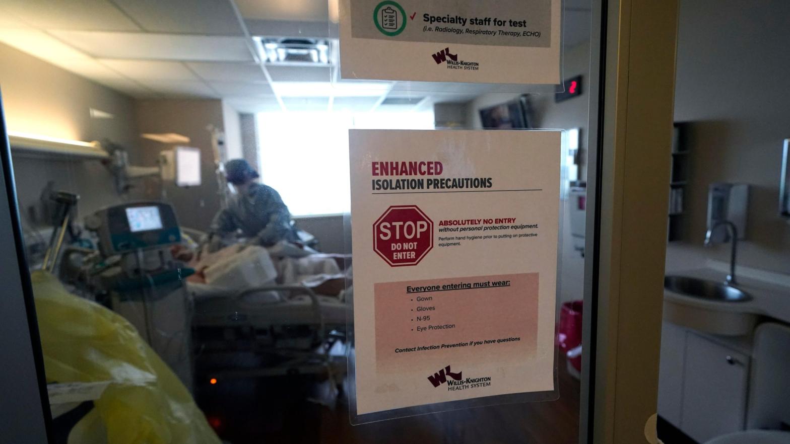 Isolation precautions are posted on a door of a patient suffering from covid-19, in an intensive care unit at the Willis Knighton Medical Centre in Shreveport, Louisiana. (Photo: Gerald Herbert, AP)