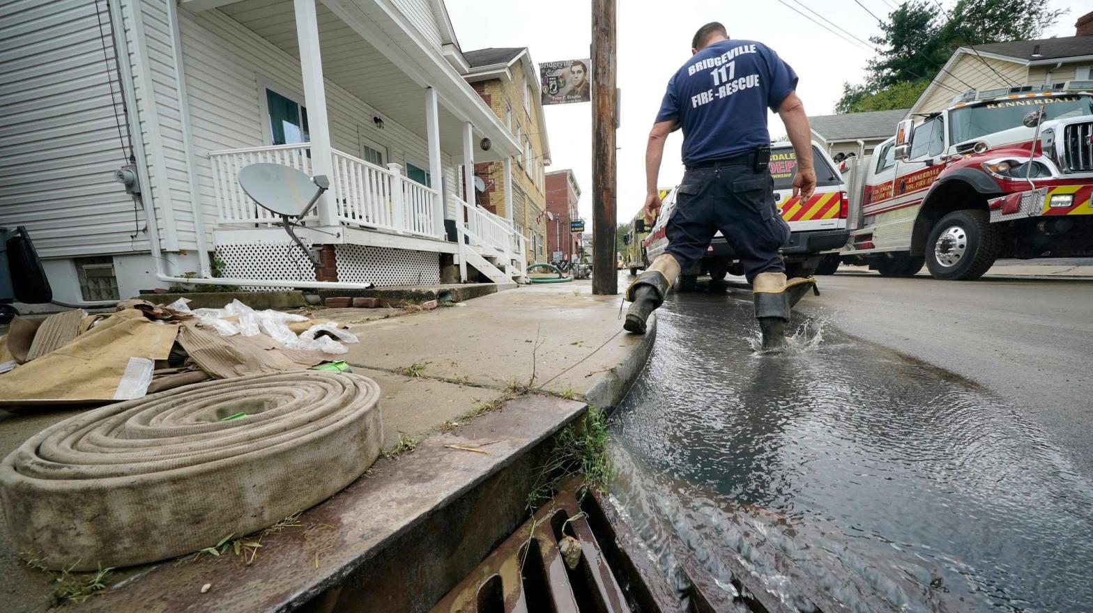 Clean up from flooding on Baldwin street in Bridgeville, Pa. continues after downpours and high winds from the remnants of Hurricane Ida, hit the area Wednesday, Sept. 1, 2021. (Photo: Gene J. Puskar, AP)