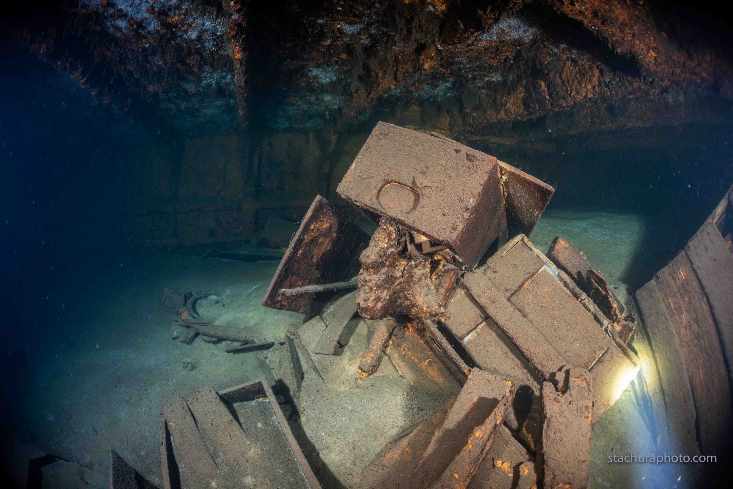 Some of the intriguing crate debris found on the shipwreck. (Photo: TOMASZ STACHURA / SANTI)