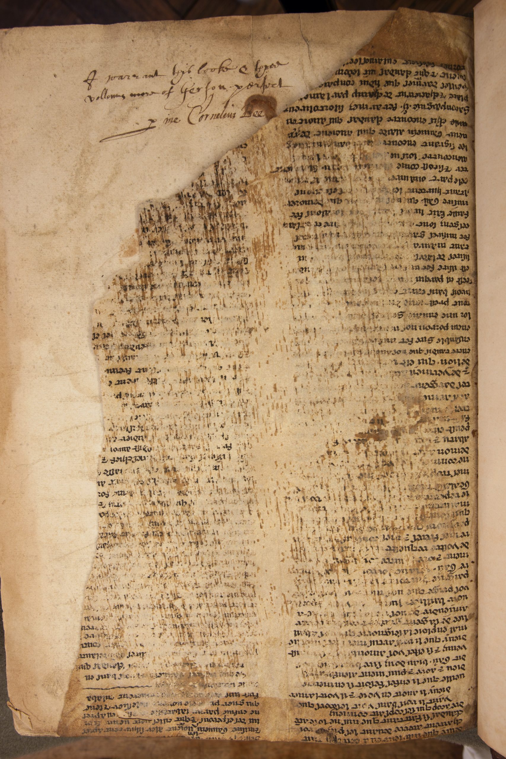 One of the manuscript fragments showing faded ink and an inscription. (Photo: Don Hooper)