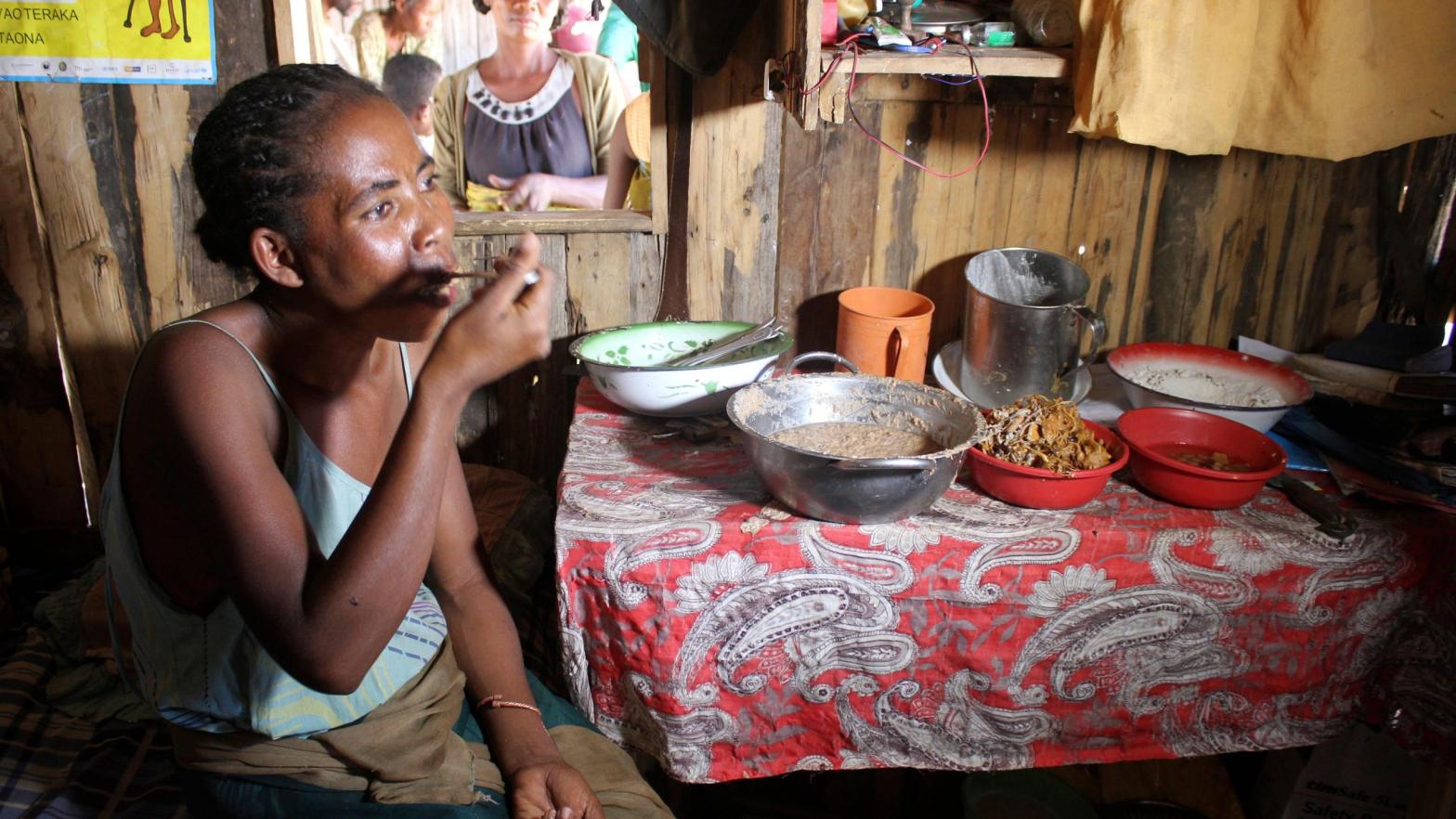 Bertine Sambetana eats clay mixed with tamarind at her home in the remote village of Fenoaivo, Madagascar. (Photo: Laetitia Bezain, AP)