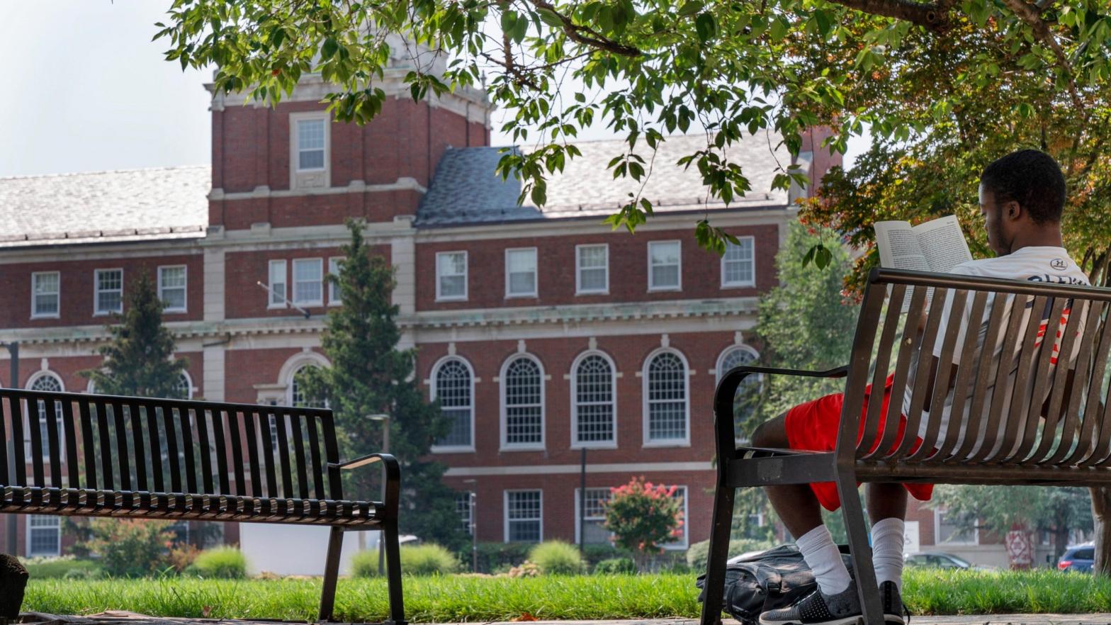 A young man reads on Howard University campus, Tuesday, July 6, 2021, in Washington. (Photo: Jacquelyn Martin, AP)