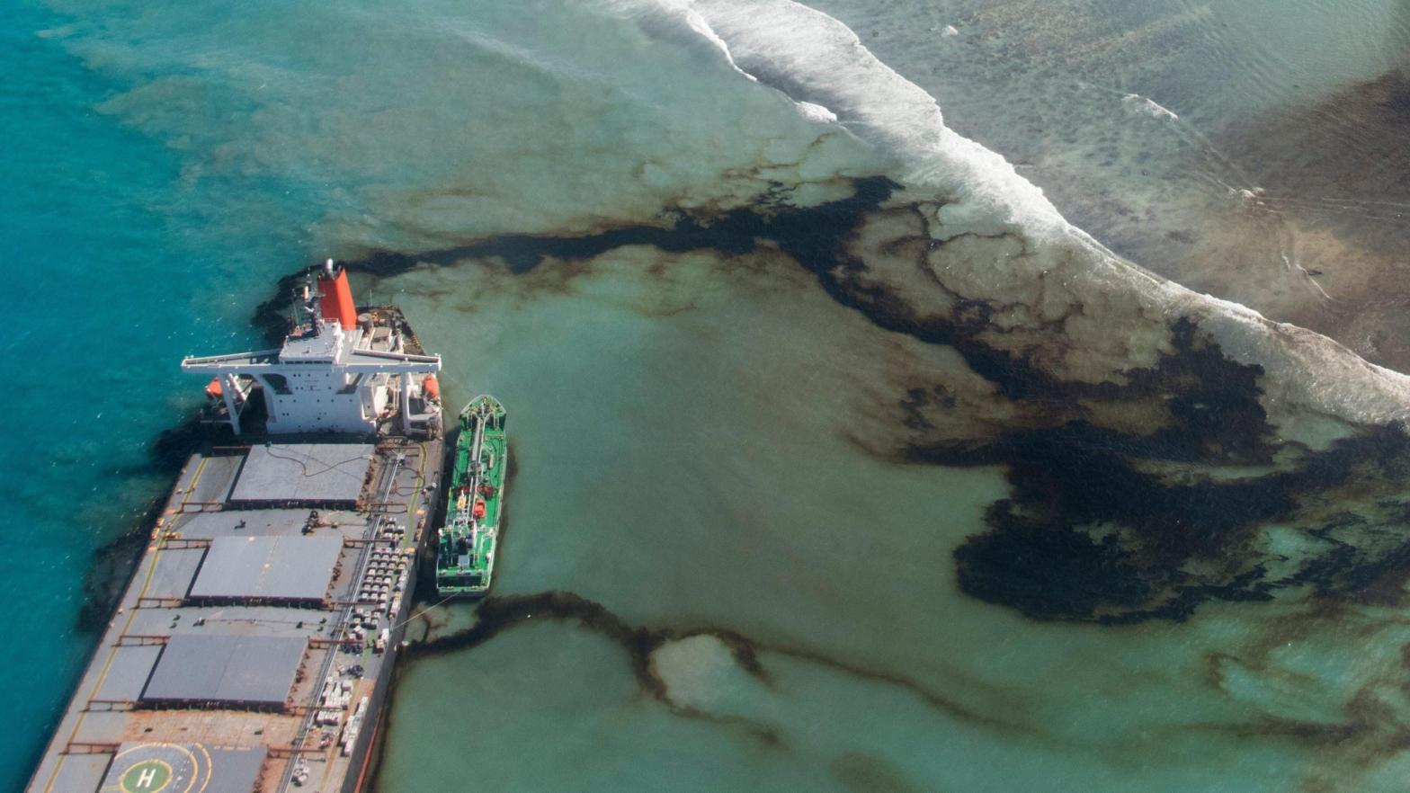 Oil leaks from the MV Wakashio, a bulk carrier ship that ran aground on a coral reef off the southeast coast of Mauritius, last August. (Photo: Gwendoline Defente/EMAE, AP)