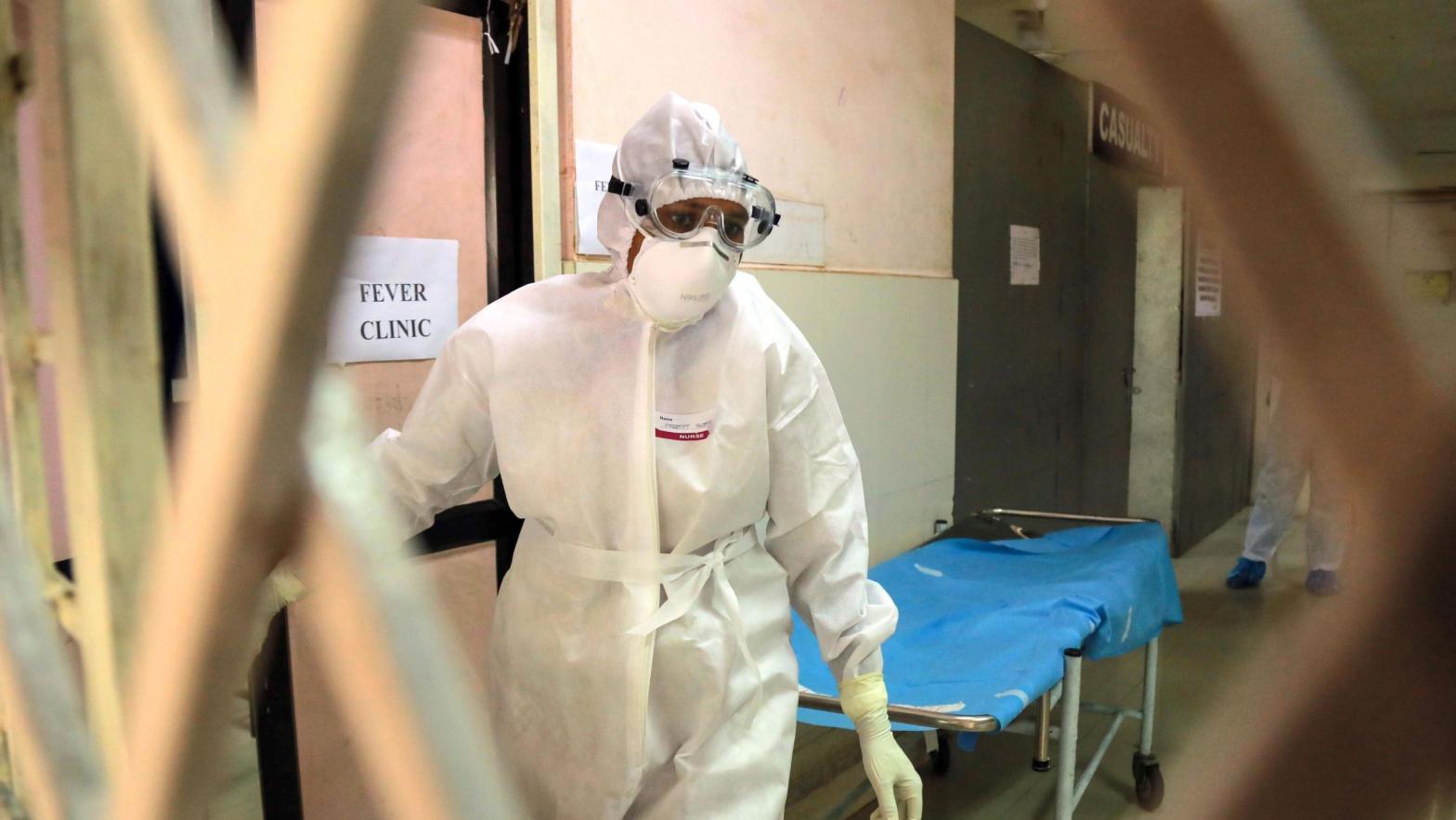 Health officials in full protective gear walk inside an isolation ward of Ernakulam Medical College in Kerala on June 6, 2019. The 2019 outbreak ultimately involved only one reported case, who successfully recovered.  (Photo: STR/AFP, Getty Images)