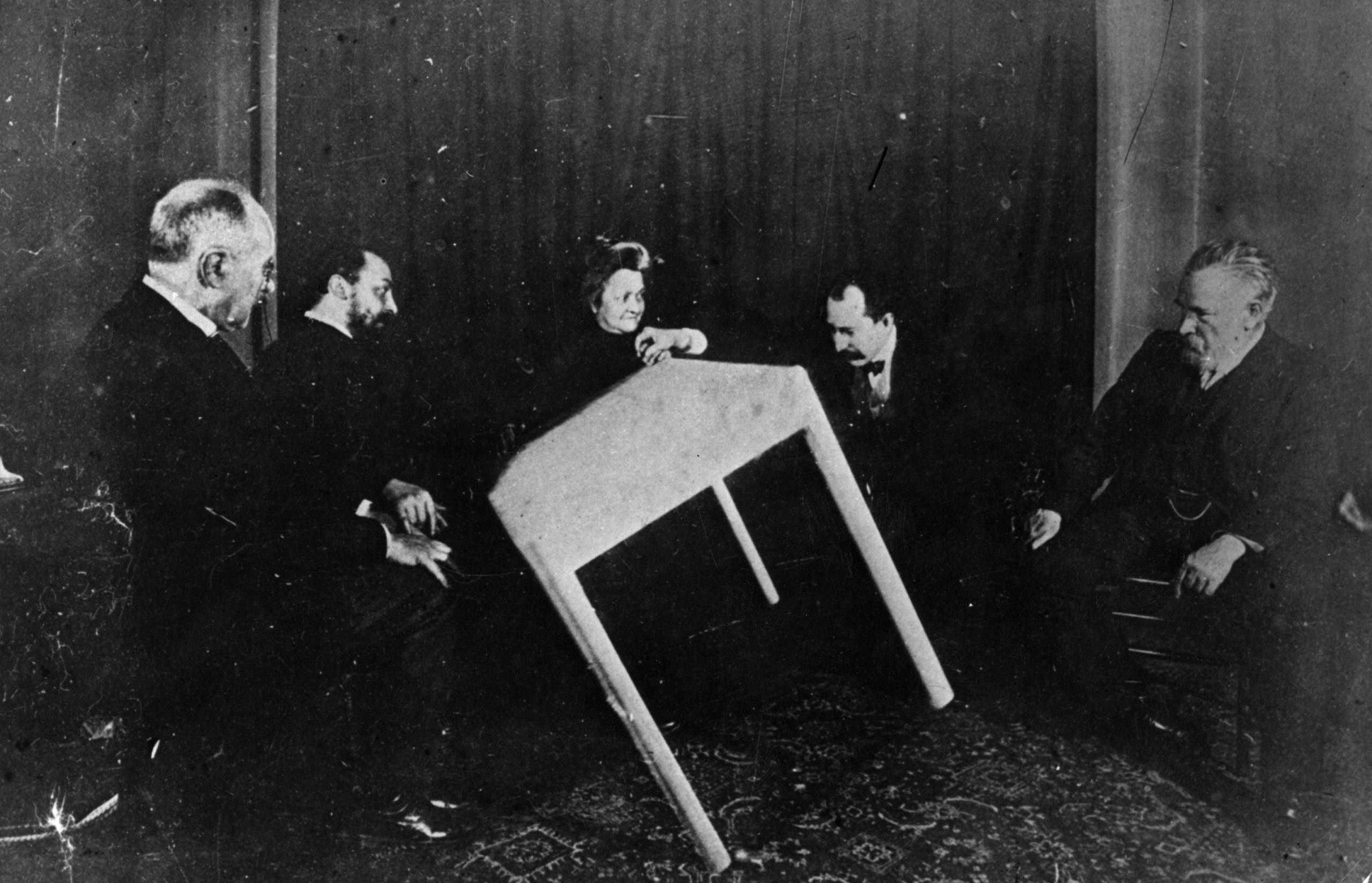 In this vintage photograph (circa 1900), a table apparently moves of its own accord during a séance in Paris. (Photo: General Photographic Agency, Getty Images)