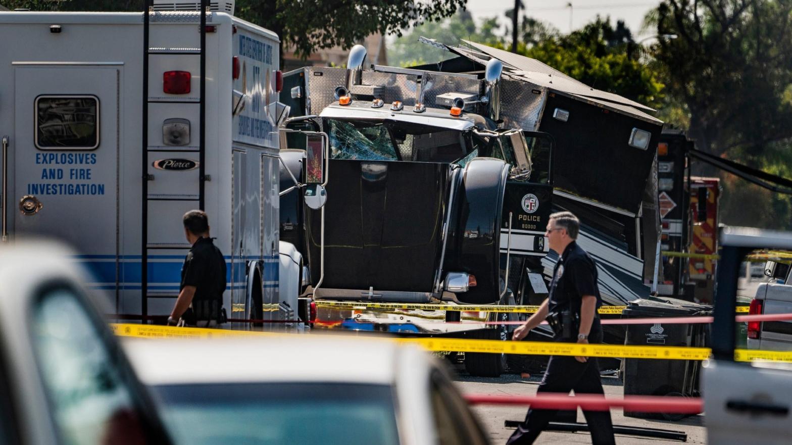 A destroyed LAPD armoured tractor-trailer seen after the agency's questionably competent bomb squad detonated way too many fireworks in a South Los Angeles neighbourhood, seen here on July 1, 2021. (Photo: Damian Dovarganes / File, AP)