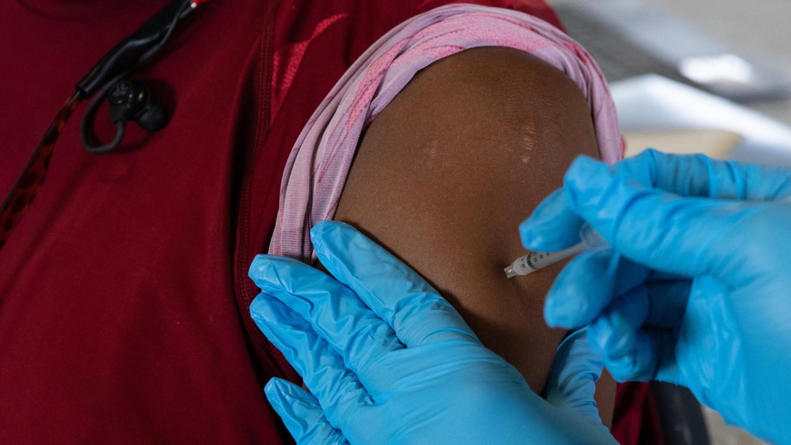 A patient receiving a coronavirus vaccine from the Oakland County Health Department clinic in Southfield, Michigan, in August 2021. (Photo: Emily Elconin, Getty Images)