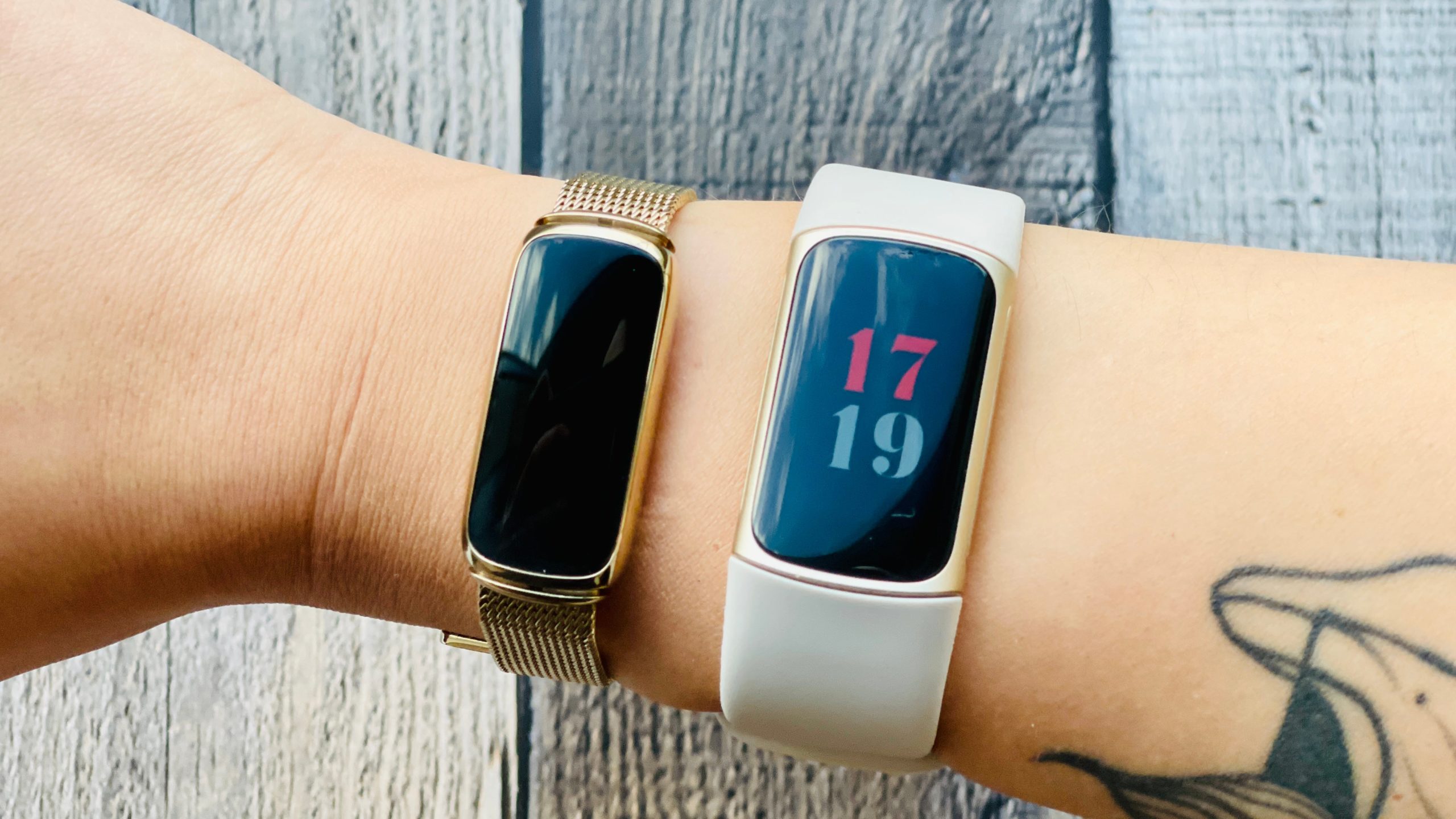 The Fitbit Luxe and the Fitbit Charge 5 are similar in design, but the Luxe might be better for smaller wrists. (Photo: Victoria Song/Gizmodo)