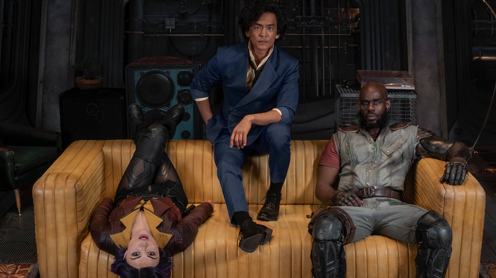 Three bisexuals, not knowing how to sit on a couch, as is the custom. (Photo: Netflix)