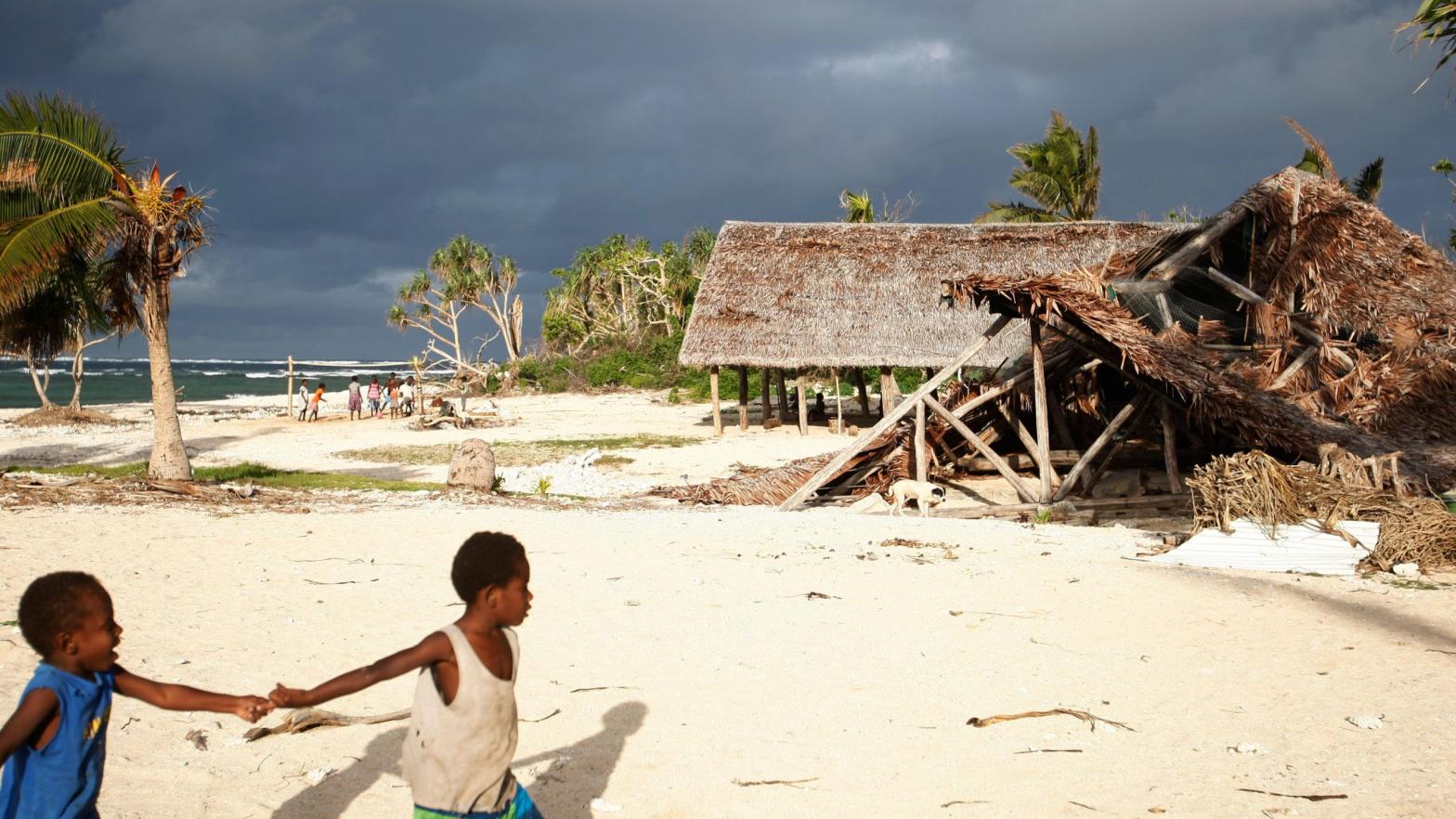 In this Saturday, May 30, 2015, photo, children play on the beach in the town of Takara, on Efate Island, Vanuatu. The town was damaged during Cyclone Pam.  (Photo: Nick Perry, AP)