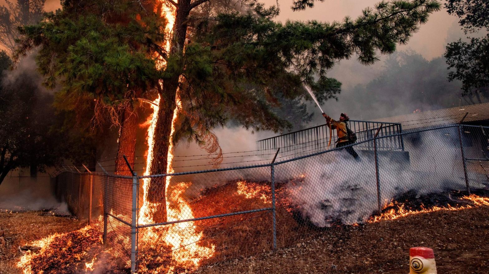 Cal Fire workers try to keep flames away from the St. Helena Water Treatment Plant in Napa Valley, California, during the Glass Fire in September 2020. (Photo: Samuel Corum / AFP, Getty Images)