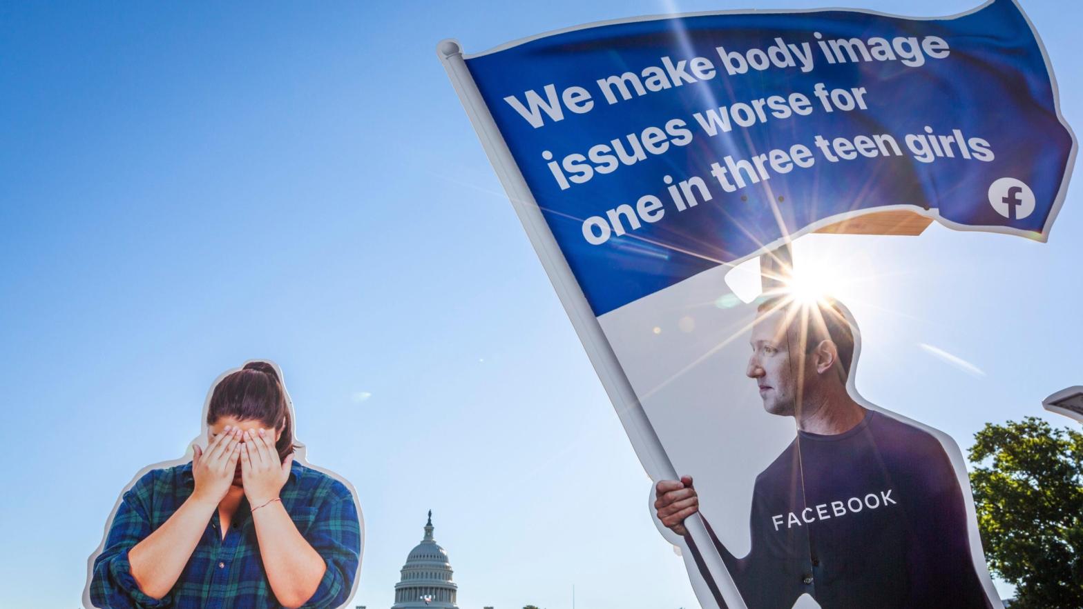 Nonprofit advocacy group SumOfUs erected a 7ft visual outside the US Capitol depicting Facebook CEO Mark Zuckerberg surfing on a wave of cash while young women around him appear to be suffering Thursday, Sept. 30, 2021, in Washington. (Photo: Eric Kayne/AP Images for SumOfUs, AP)