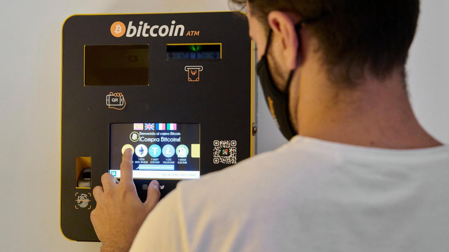 A man using a General Bytes cryptocurrency ATM in Palma de Mallorca, Spain in August 2021. (Photo: Carlos Alvarez, Getty Images)