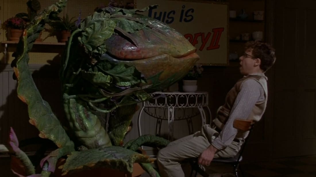 Rick Moranis is in trouble in Little Shop of Horrors. (Image: Warner Bros.)