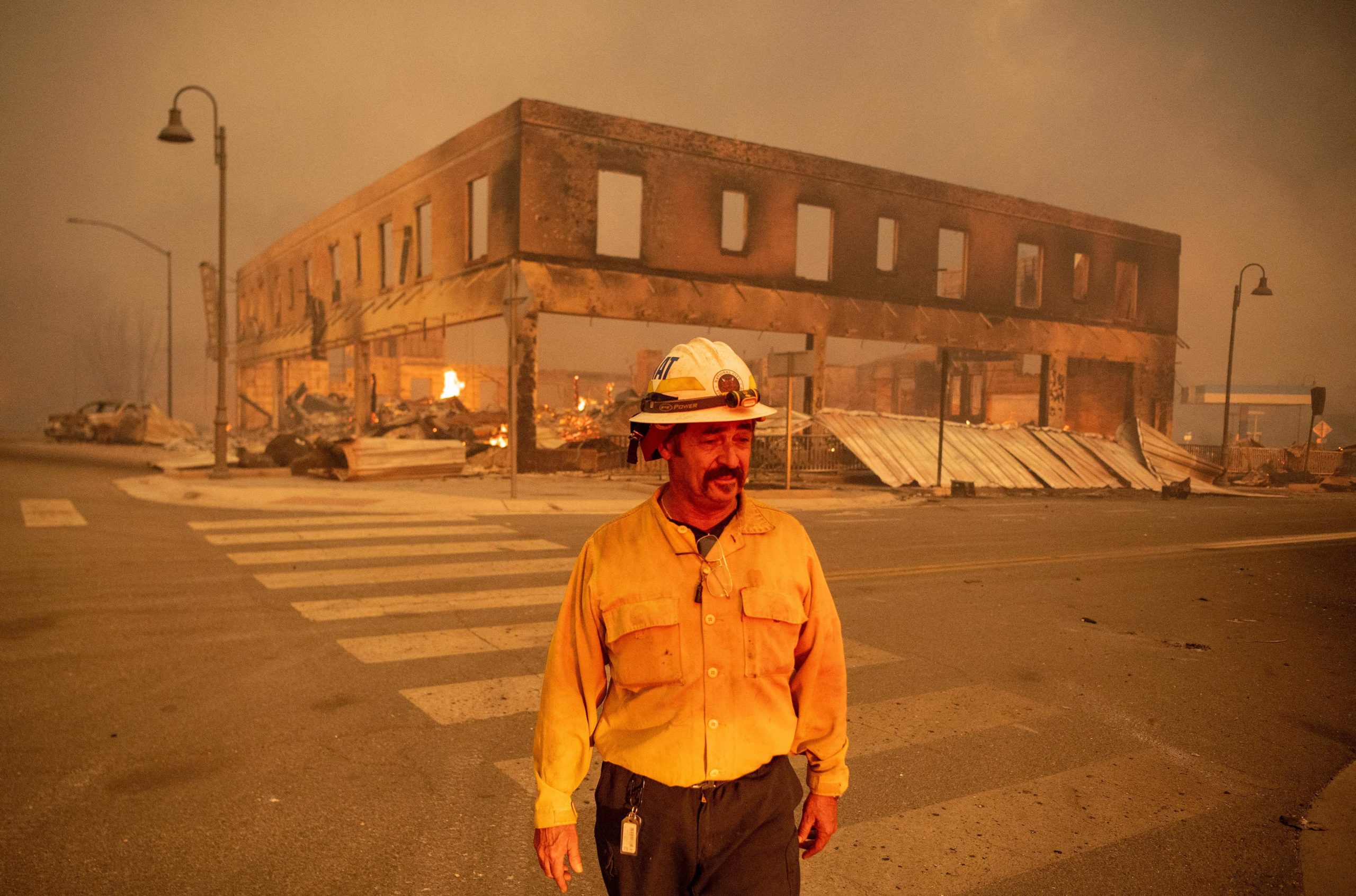 Battalion Chief Sergio Mora looks on as the Dixie fire burns through downtown Greenville, California, on Aug. 4, 2021. (Photo: Josh Edelson/AFP, Getty Images)