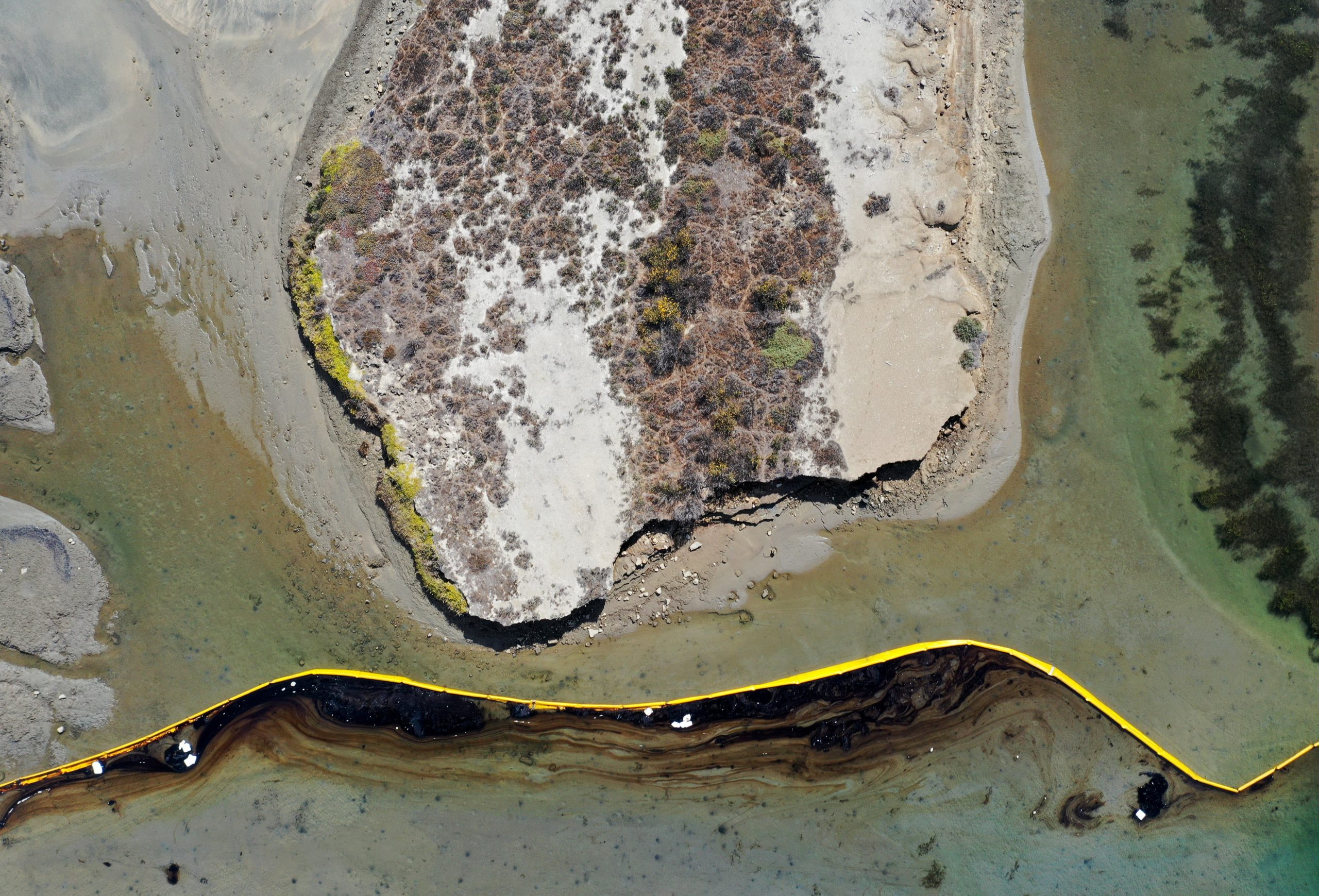 A boom contains oil-contaminated water in the area of the Talbert Marsh wetlands. (Photo: Mario Tama/Getty Images, Getty Images)