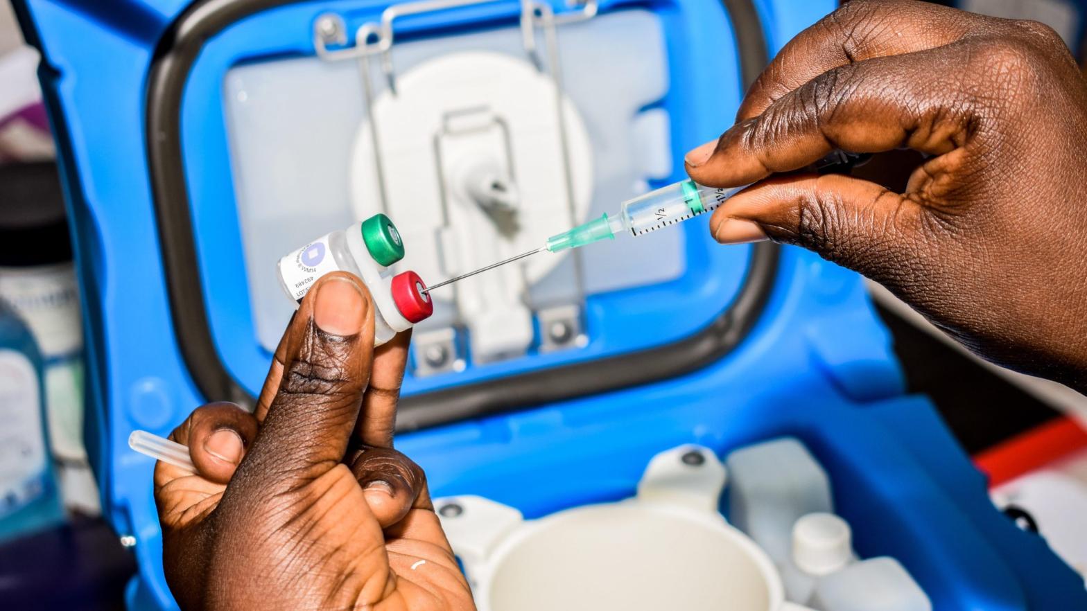 A health worker prepares a dose of the Mosquirix malaria vaccine in Ndhiwa, Homabay County, western Kenya on September 13, 2019. (Photo: Brian Ongoro, Getty Images)