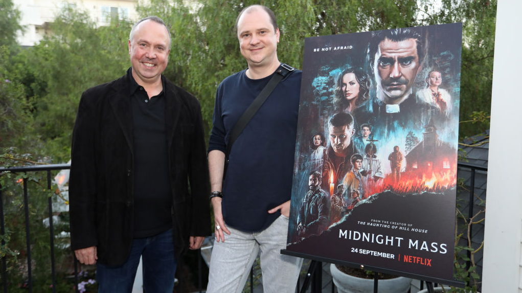 Mike Flanagan (right) and Intrepid Pictures partner Trevor Macy (left) attend a screening of Flanagan's latest Netflix series, Midnight Mass. (Photo: Rachel Murray, Getty Images)