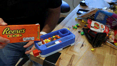 The Perfect iPhone 13 Case Holds a Bunch of Candy and Shoots It Into Your Mouth