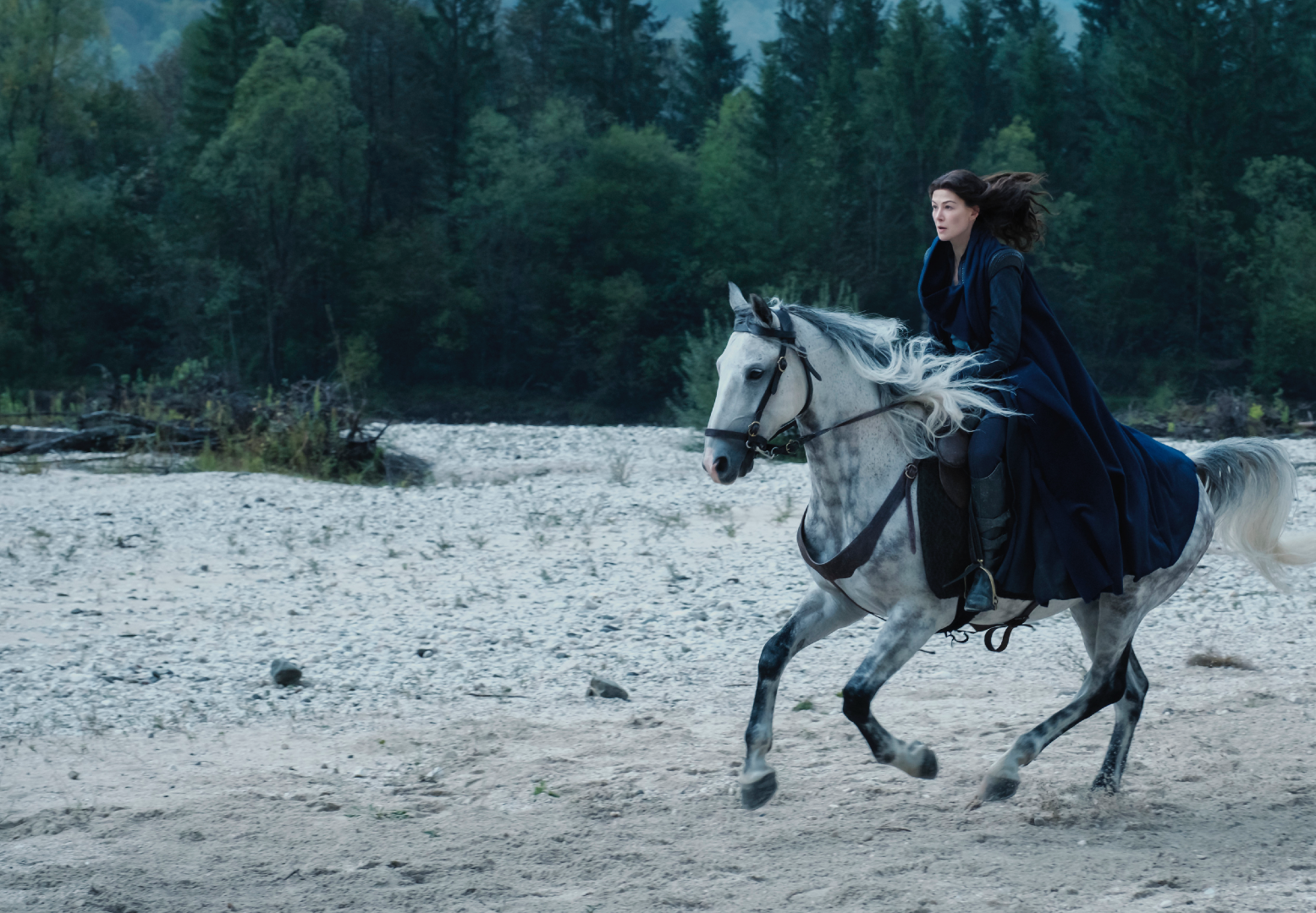 Moraine (Rosamund Pike) rides like the wind. (Image: Amazon Studios)