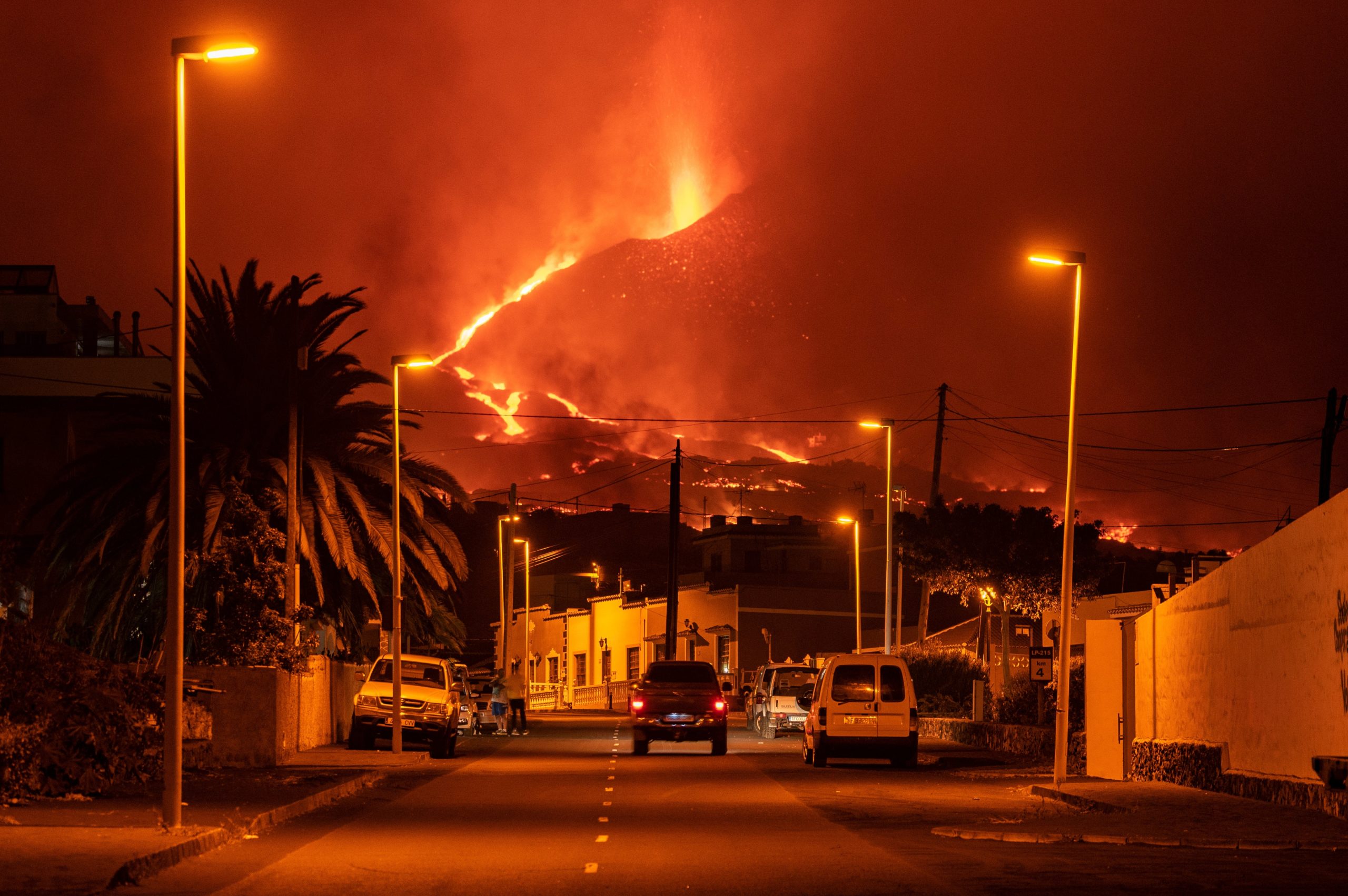 A car drives through an empty street in the neighbourhood of La Laguna as lava flows from the Cumbre Vieja Volcano on October 9, 2021 in La Palma, Spain. (Photo: Marcos del Mazo, Getty Images)