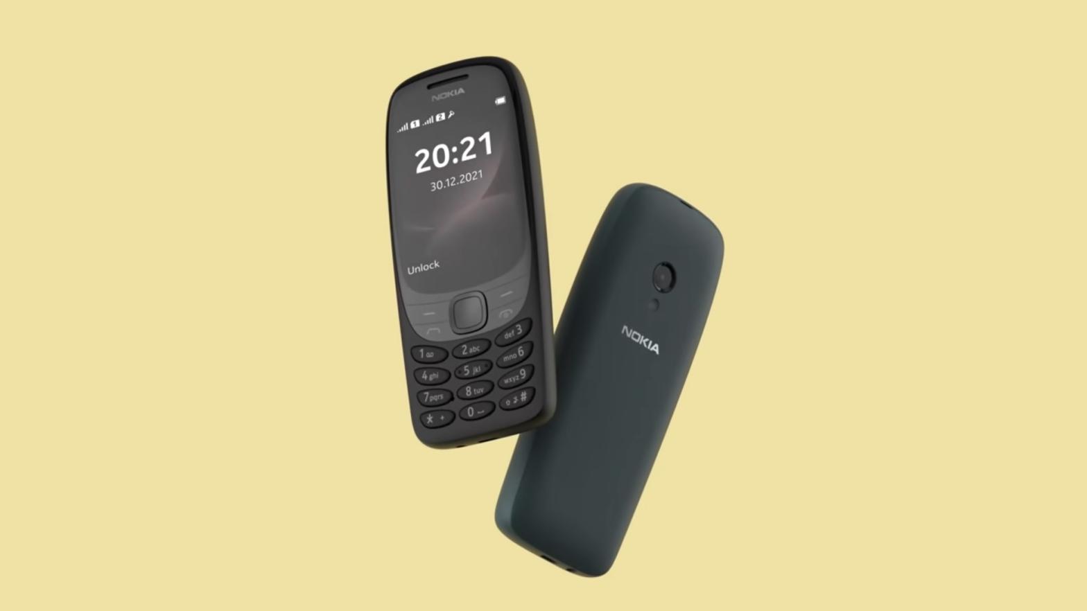 Two Nokia 6310s float in front of a yellow background